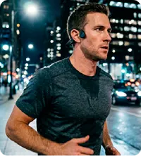 A person running wearing Walla Sound Beat bone conduction headphones
